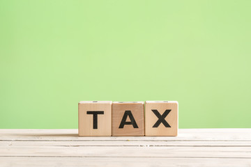 Tax sign on a green background