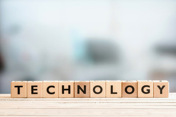Technology sign on a wooden desk