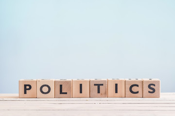 Politics sign made of wooden cubes
