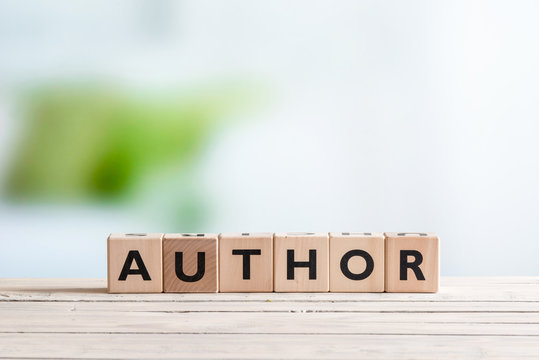 Author sign on a wooden desk