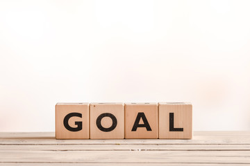 Goal sign on a wooden desk