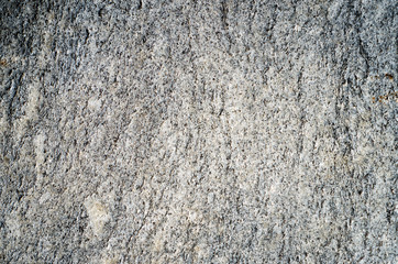 Flat surface of a gray granite stone