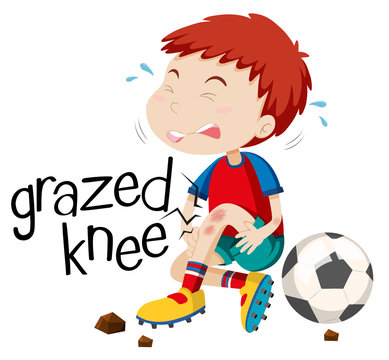 Boy having grazed knee