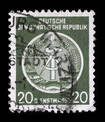Obraz premium Stamp printed in GDR (German Democratic Republic - East Germany) shows DDR national coat of arms with inscription Service Stamp, series GDRs national coat of arms, circa 1952