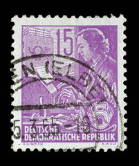 Stamp printed in GDR (German Democratic Republic - East Germany) shows a Woman on the teletype without the inscription, from the series Workers For The Five-year Plan, circa 1953