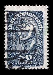 Obraz premium Stamp printed in the Austria shows Man, Allegory of New Republic, Austria, circa 1919