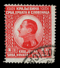 Stamp printed in Yugoslavia (Kingdom Serbia, Croatia and Slovenia) shows portrait of King Alexander...