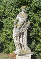 sculpture of woman in garden of old castle  in Tuscany city in Italy