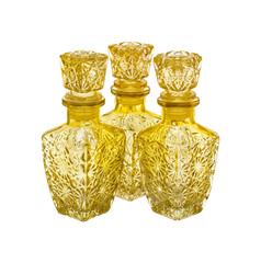 Three yellow decanters isolated on a white background
