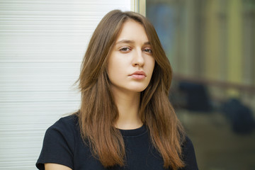 Fototapeta premium Close up of young beautiful woman in black dress