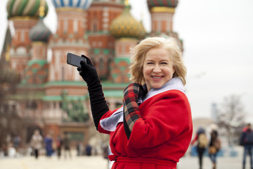 Mature blonde woman on Red Square in Moscow