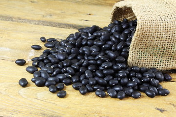 dry black beans in jute bag
