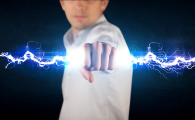 Business man holding electricity light bolt in his hands