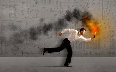 Running business man with fire laptop