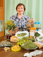 mature woman doing herbal tea with herbs