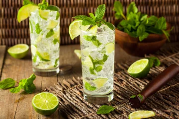 Tuinposter Homemade Alcoholic Mojito with LIme © Brent Hofacker