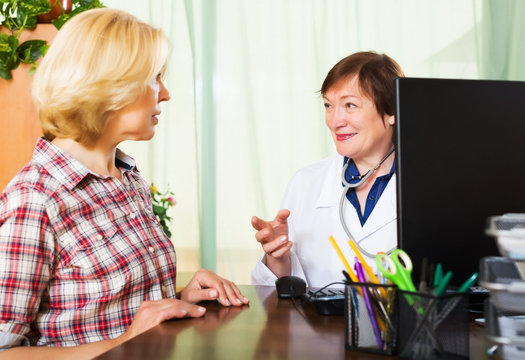 Aged Doctor Having Good News For A Person