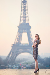 Beautiful elegant Parisian woman near the Eiffel tower