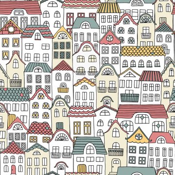 Hand drawn seamless pattern of a city with cute houses