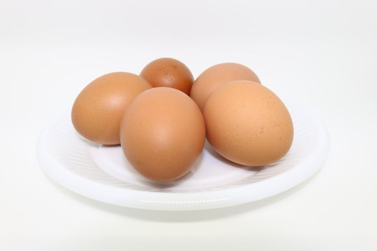 Hen eggs on white background.