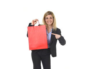 Fototapeta premium young happy beautiful woman in business suit in excited face expression holding red shopping bag