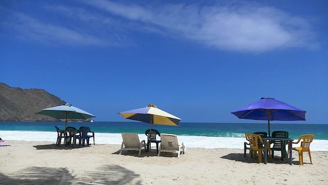 Beach chairs and umbrellas at a Caribbean exotic beach