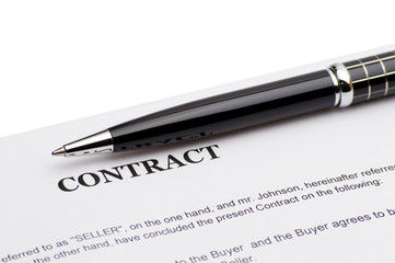 Close-up of pen on contract 