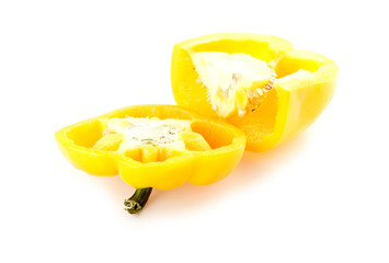 Inside of yellow capsicum with seeds isolated on white