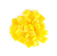 Circular pile of chopped yellow capsicum on white background