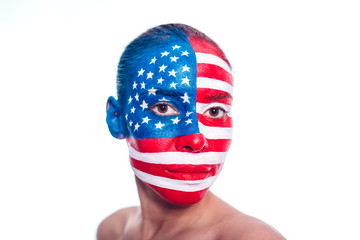 Portrait of a girl with a painted American flag, closeup