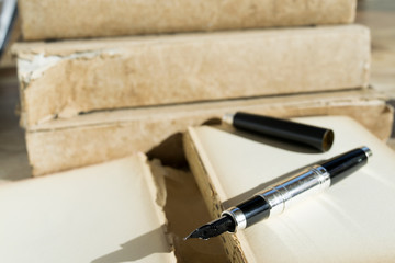 stylographic pen and ancient manuscript