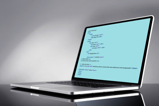 Programming code on laptop monitor