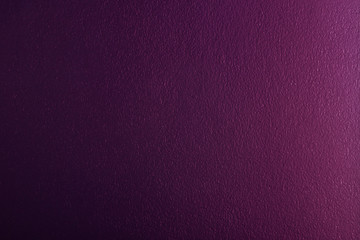 light shines on dark purple colored concrete wall