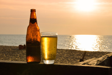 Glass of beer on a sunset