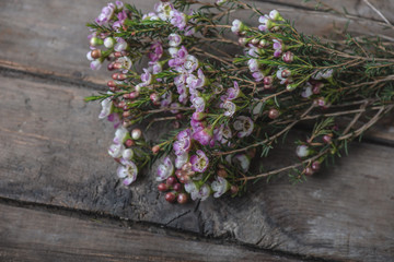 Bouquet of wildflowers on vintage wooden floor