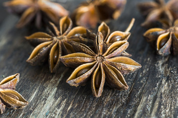 Closeup of star anise on wooden background