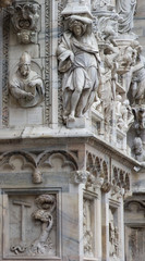 Fototapeta na wymiar Details of the ornate marble façade at Milan Cathedral