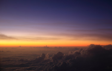 A pre-dawn sky above the clouds over Indonesia taking during a flight at 35,000ft.