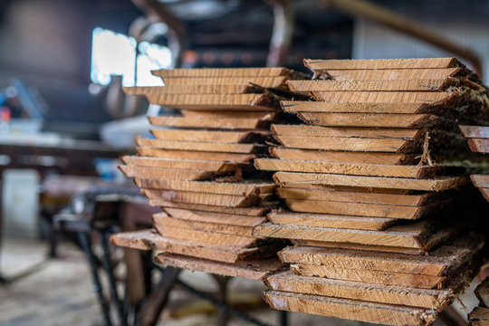 Woodworking plant. Boards stacked in pile
