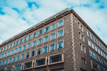 Fototapeta premium Corner of Modern Low Rise Brown Brick Building