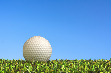 Golf on grass.