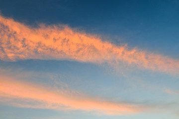Naklejka na ściany i meble background of the sky with clouds at sunset