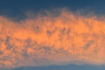 Naklejka na ściany i meble background of the sky with clouds at sunset