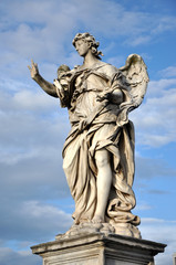 Fototapeta na wymiar Angel with the Nails. Statue on the Ponte Sant' Angelo bridge, R