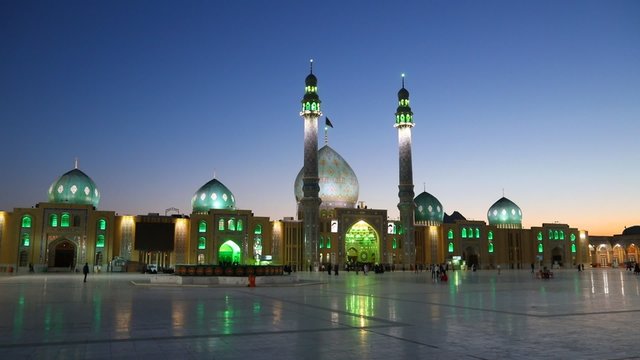 People walking in the yard of Jamkaran mosque. Qom, Iran