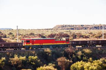Naklejka premium A train transports minerals from a mine not far from Upington, South Africa.