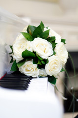 wedding bouquet on a white piano