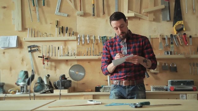 Carpenter in the carpentry workshop
