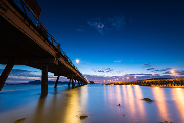 Bridge to the sea at sunrise, chalong harbor Phuket Thailand, lo