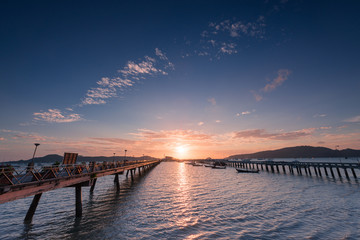 Fototapeta na wymiar Bridge to the sea at sunrise, chalong harbor Phuket Thailand